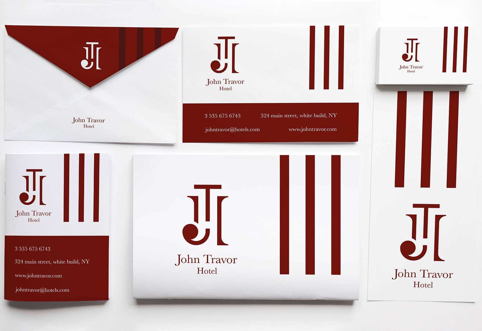 Logo e brand identity di John Travor Hotel realizzato da SEBA! grafico di Gravellona Toce nel VCO di busta da lettere, carta d'invito, biglietto da visita e libretto illustrativo