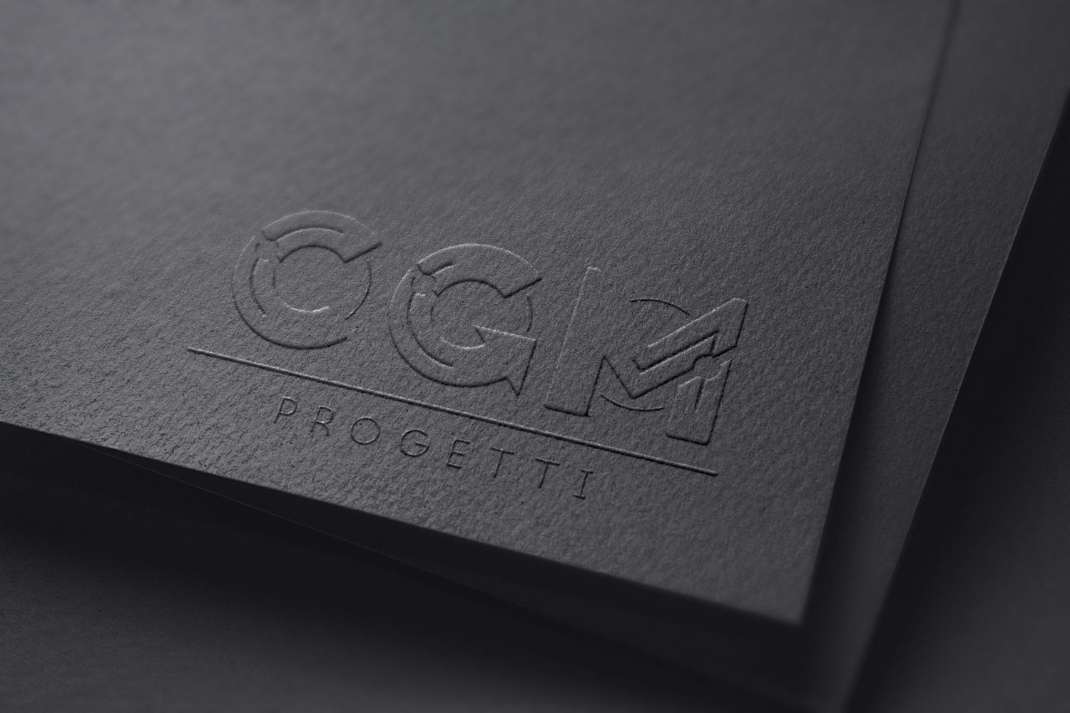 Logo e brand identity di CGM Progetti realizzato da SEBA! grafico di Gravellona Toce nel VCO del marchio pressato su cartoncino nero