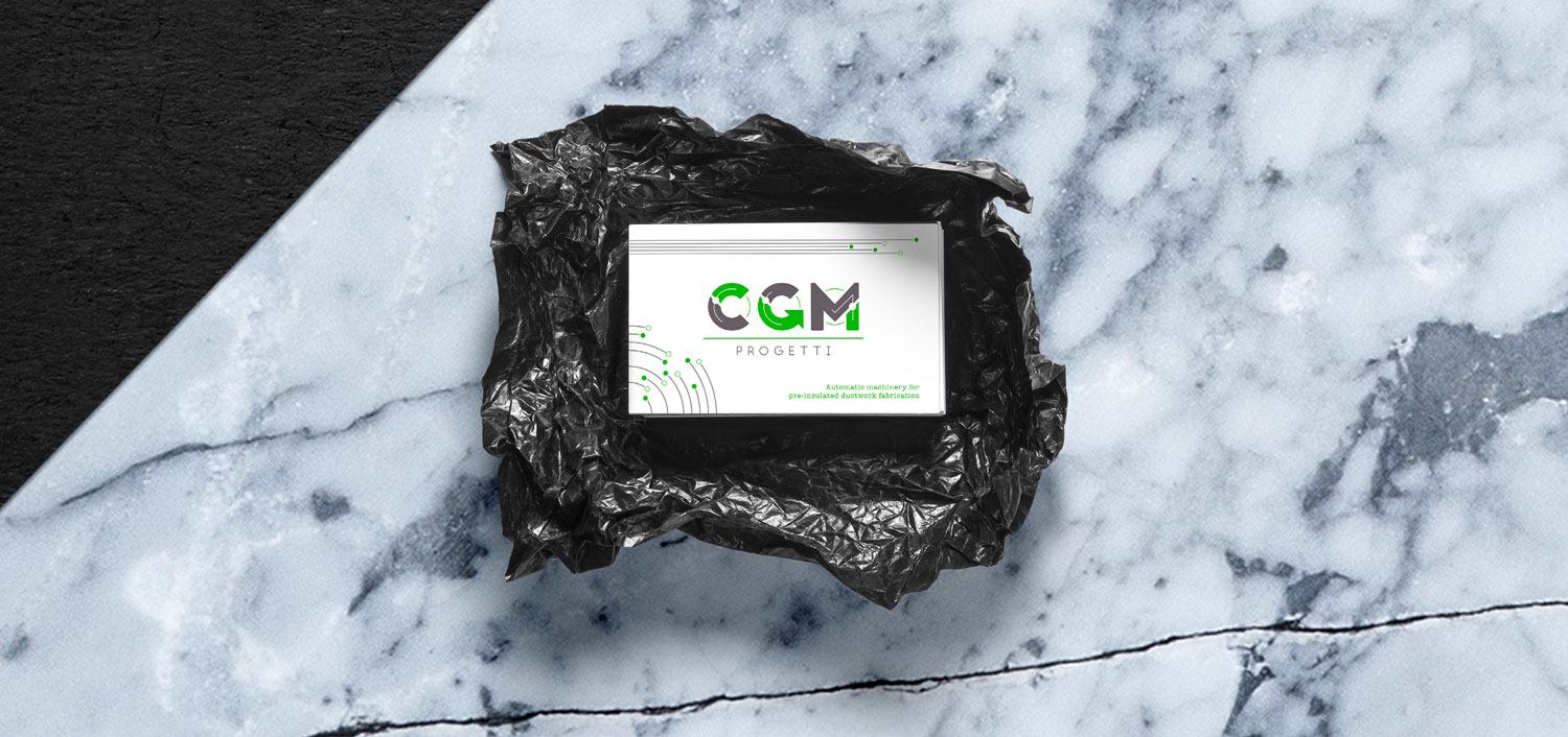 Logo e brand identity di CGM Progetti realizzato da SEBA! grafico di Gravellona Toce nel VCO dei biglietti da visita su sfondo di marmo