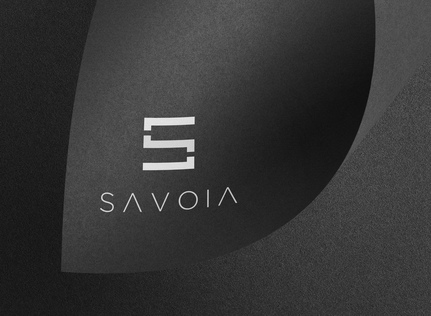 Logo e brand identity di Savoia realizzato da SEBA! grafico di Gravellona Toce nel VCO di marchio su cartoncino nero