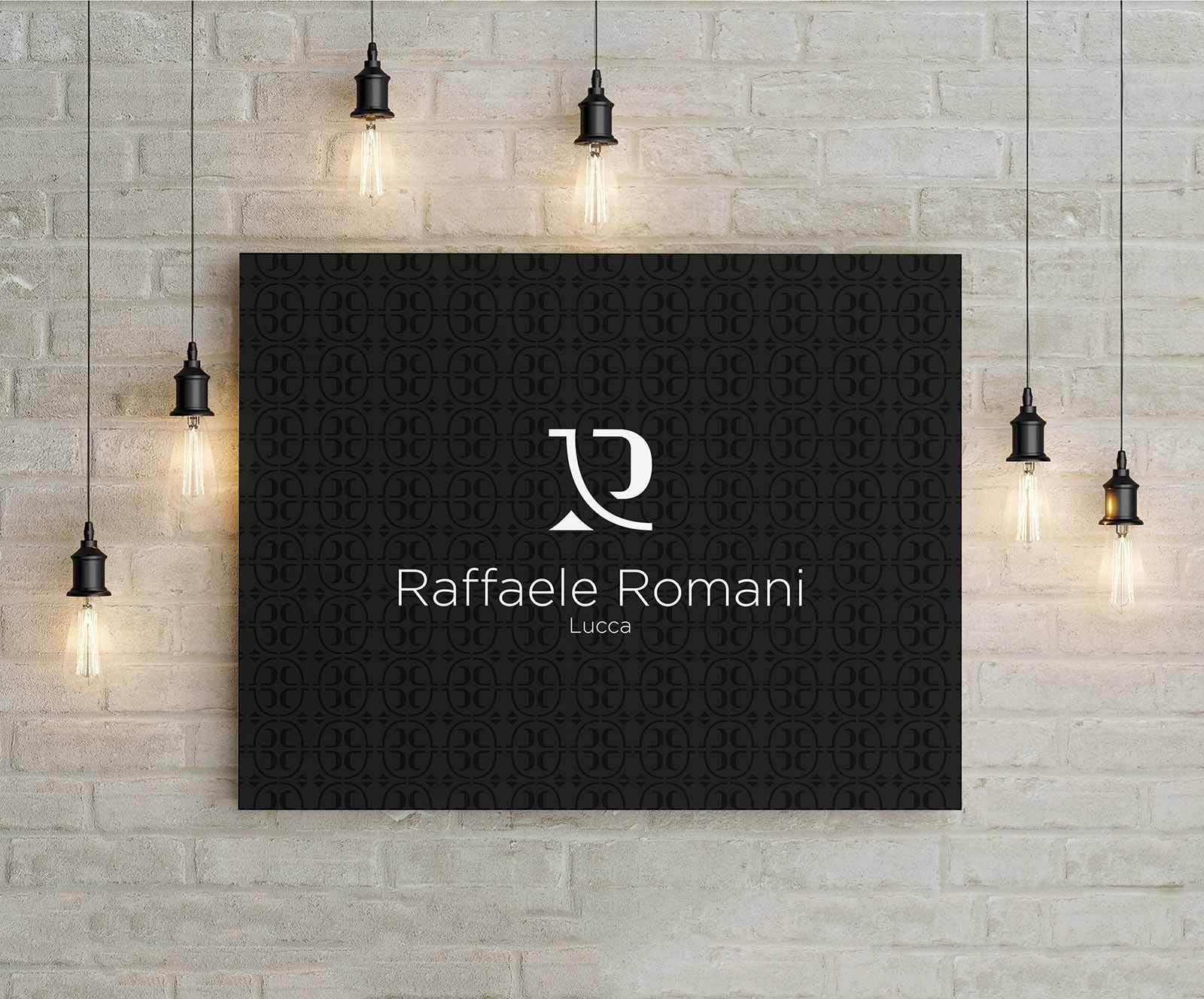 Logo e brand identity di Raffaele Romani realizzato da SEBA! grafico di Gravellona Toce nel VCO di un quadro con delle lampade